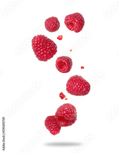 Fototapeta Naklejka Na Ścianę i Meble -  Ripe raspberries floating in the air close-up on a white background