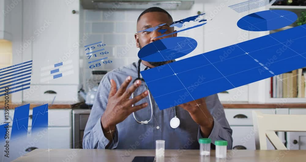 At kitchen table, man with animation of graphs and charts, smiling At kitchen table, man with animation of graphs and charts, smiling