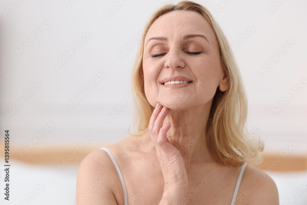 Smiling middle aged woman at home. Space for text Smiling middle aged woman at home. Space for text