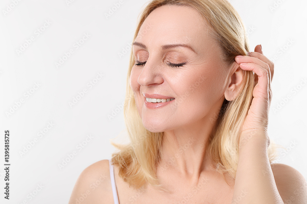 Smiling middle aged woman on white background. Space for text Smiling middle aged woman on white background. Space for text