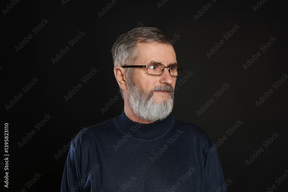 Portrait of mature man in glasses on black background Portrait of mature man in glasses on black background