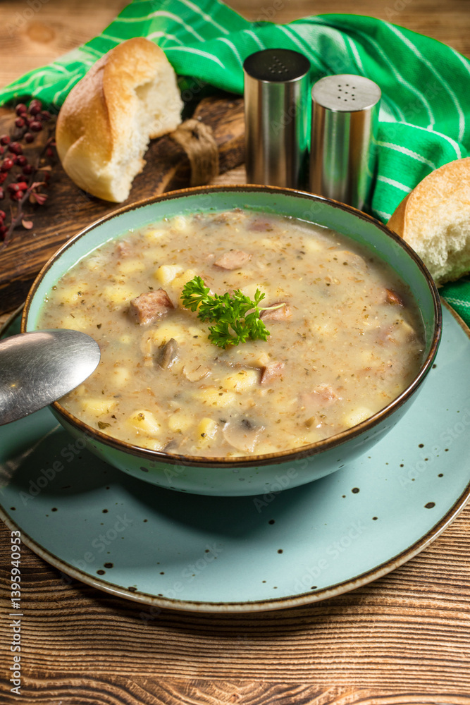 Traditional polish soup Zurek in ceramic bowl.