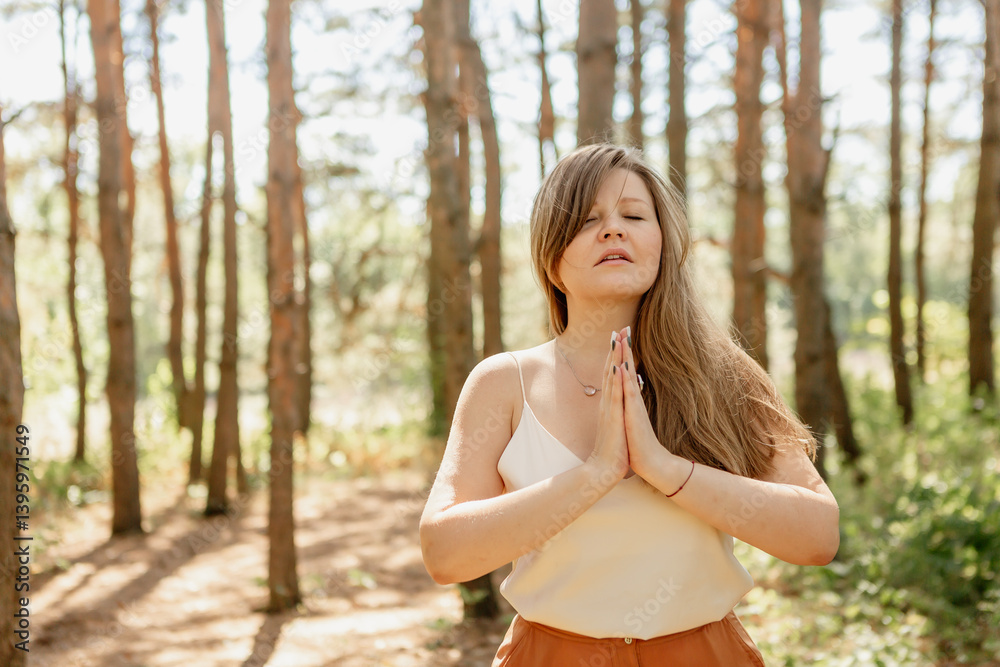 beautiful young woman walks in the woods in the summer, meditates beautiful young woman walks in the woods in the summer, meditates