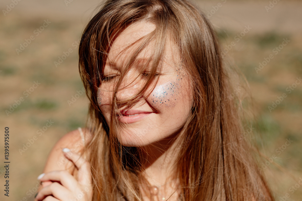 portrait of a young woman with long brown hair enjoying the summer sun, meditating portrait of a young woman with long brown hair enjoying the summer sun, meditating