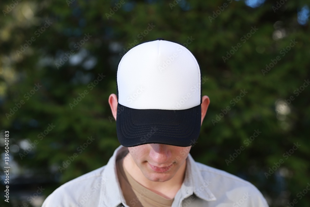 Man in stylish baseball cap outdoors. Mockup for design Man in stylish baseball cap outdoors. Mockup for design