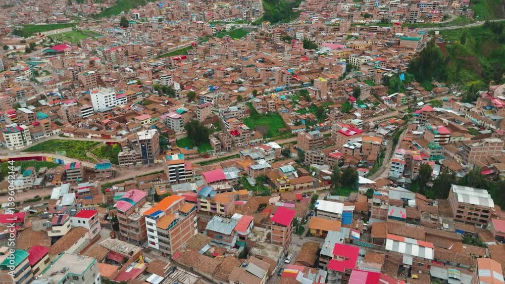 Aerial View of Cusco City and Surrounding Hillside Neighborhoods, Peru. Drone footage capturing a sweeping aerial view of Cusco, the historic capital of the Inca Empire, in the Peruvian Andes Aerial View of Cusco City and Surrounding Hillside Neighborhoods, Peru. Drone footage capturing a sweeping aerial view of Cusco, the historic capital of the Inca Empire, in the Peruvian Andes