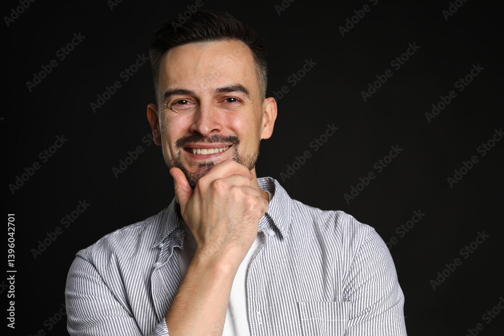 Portrait of handsome middle aged man on black background Portrait of handsome middle aged man on black background