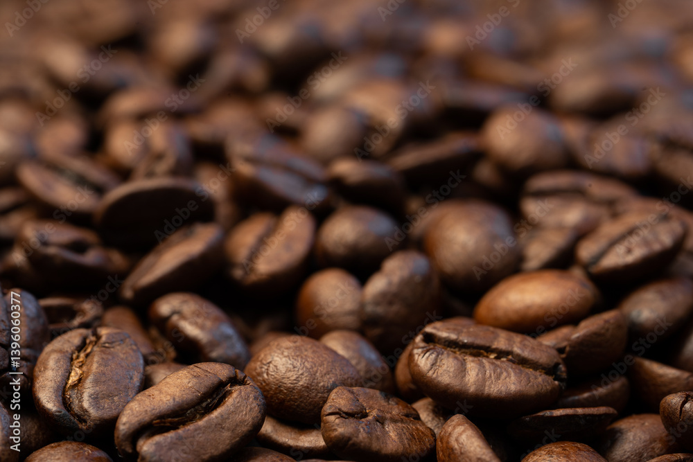 A rich, close-up macro shot of roasted coffee beans with a shallow depth of field, emphasizing the texture, detail, and oily surface of the beans. The blurred background enhances focus on the foregrou A rich, close-up macro shot of roasted coffee beans with a shallow depth of field, emphasizing the texture, detail, and oily surface of the beans. The blurred background enhances focus on the foregrou