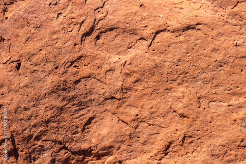 Obraz na płótnie A detailed close-up photo of an old red brick with a rugged texture w salonie