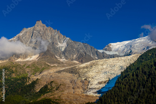 Aiguille du Midi peak in the Alps. Chamonix valley landscape of a prominent rocky towering mountain peak in French Alps. Chamonix-Montblanc area beautiful landscape of Aiguille du Midi summit, France