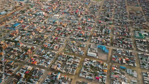 Drone footage capturing the city of Uyuni, Bolivia, showcasing its unique urban landscape and the surrounding natural beauty. Aerial View of Uyuni, Bolivia - City and Surroundings