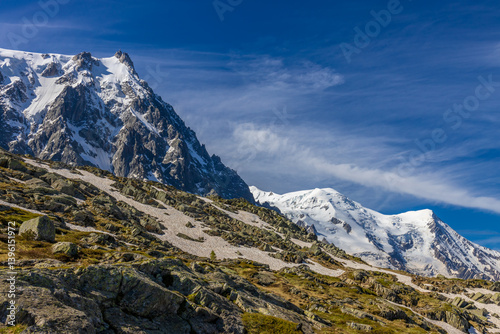 Aiguille du Midi peak in the Alps. Chamonix valley landscape of a prominent rocky towering mountain peak in French Alps. Chamonix-Montblanc area beautiful landscape of Aiguille du Midi summit, France