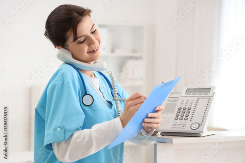 Female medical intern talki...