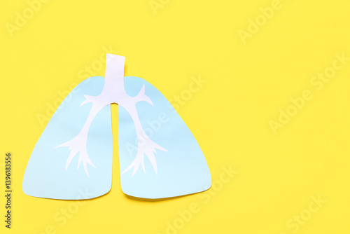 Paper lungs on yellow backg...