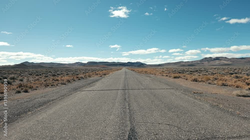 Empty road in nevada desert on a sunny day Empty road in nevada desert on a sunny day