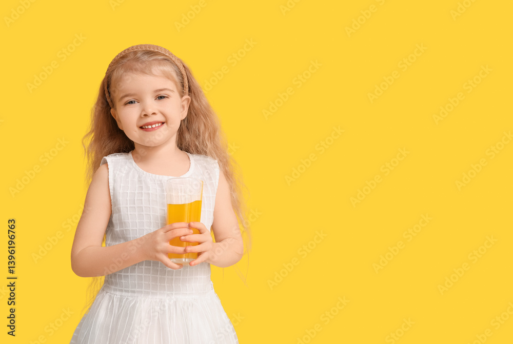 Adorable little girl with glass of orange juice on yellow background Adorable little girl with glass of orange juice on yellow background