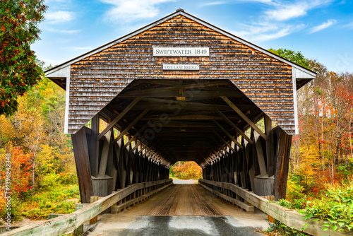 Obraz na płótnie Swiftwater Covered Bridge in Bath, New Hampshire. Built in 1849, Swiftwater Covered Bridge is one of New Hampshire's few surviving 19th-century covered bridges. w salonie
