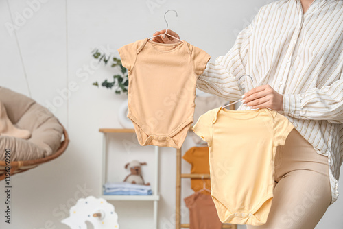 Young woman with baby bodys...