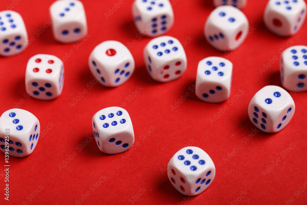 White game dices on red background, closeup White game dices on red background, closeup