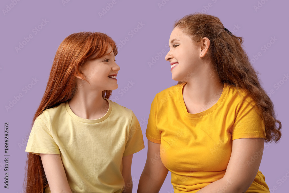 Beautiful young woman with her cute daughter on lilac background. Mother's Day celebration Beautiful young woman with her cute daughter on lilac background. Mother's Day celebration