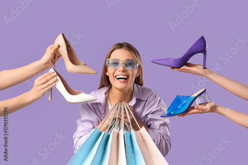 Stylish young woman holding...
