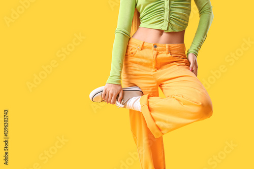 Young woman in vibrant gree...