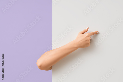 Female hand pointing at bla...