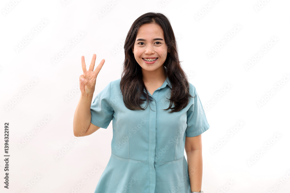 Smiling happy good looking asian girl giving advice, showing three finger as explain rules, make point, standing white background Smiling happy good looking asian girl giving advice, showing three finger as explain rules, make point, standing white background