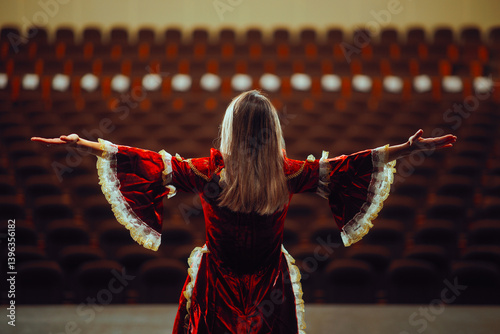 Obraz na plátně Actress Wearing a Royal Dress Rehearsing in an Empty Theater