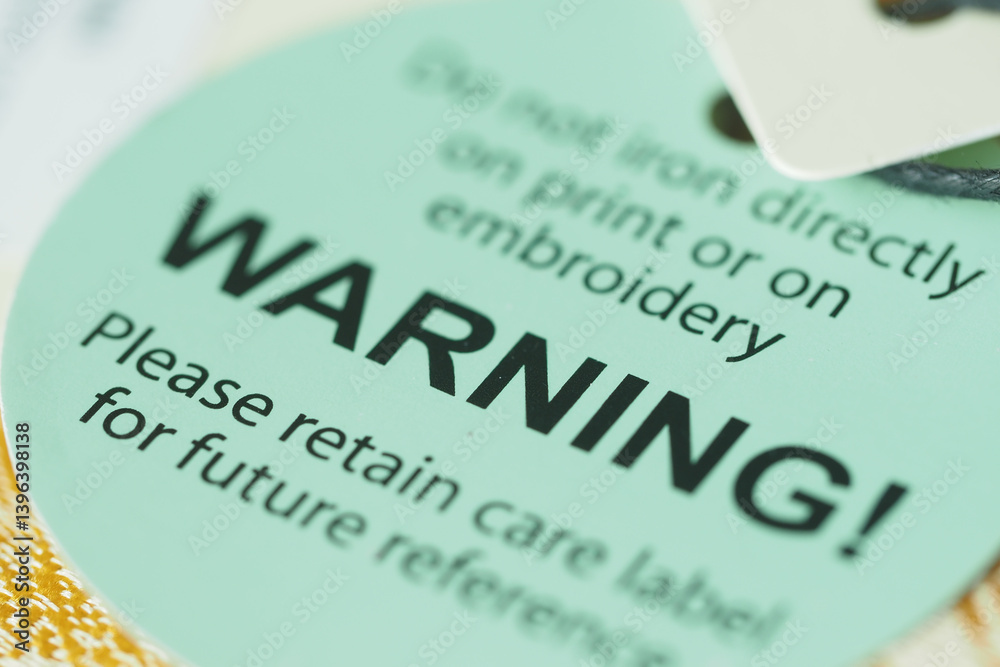 Obraz premium Warning label on clothing care instructions for proper handling