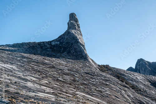 Granite plateau on Mt.Kinabalu with an iconic Donkey's Ear Peak. Mt Kinabalu is one of the highest mountain in South East Asia.
