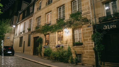 Charming Parisian Street at Night: Stone Buildings, Lush Greenery, and Warm Lighting