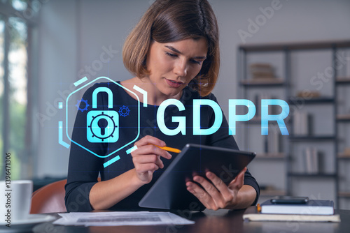 Businesswoman holding tablet device, touching screen. Office workplace. Concept of infromation security, distant work, business education, information technology.