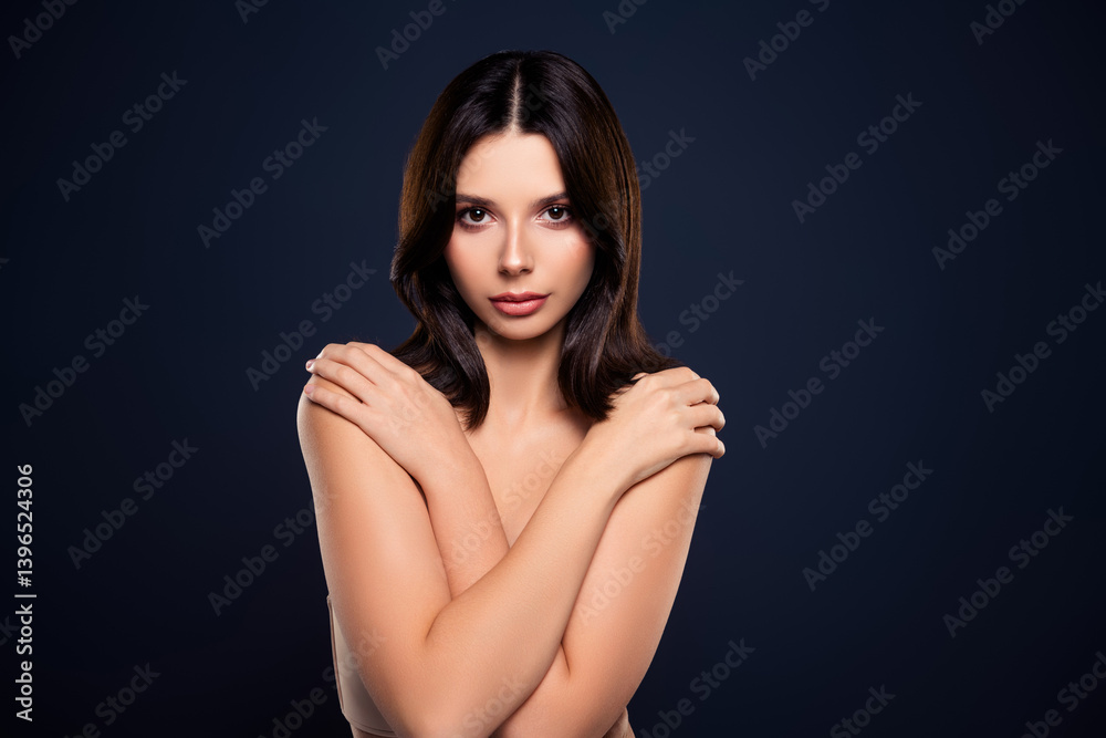 Portrait of a Beautiful Young Woman Posing Elegantly Against a Dark Blue Background Portrait of a Beautiful Young Woman Posing Elegantly Against a Dark Blue Background