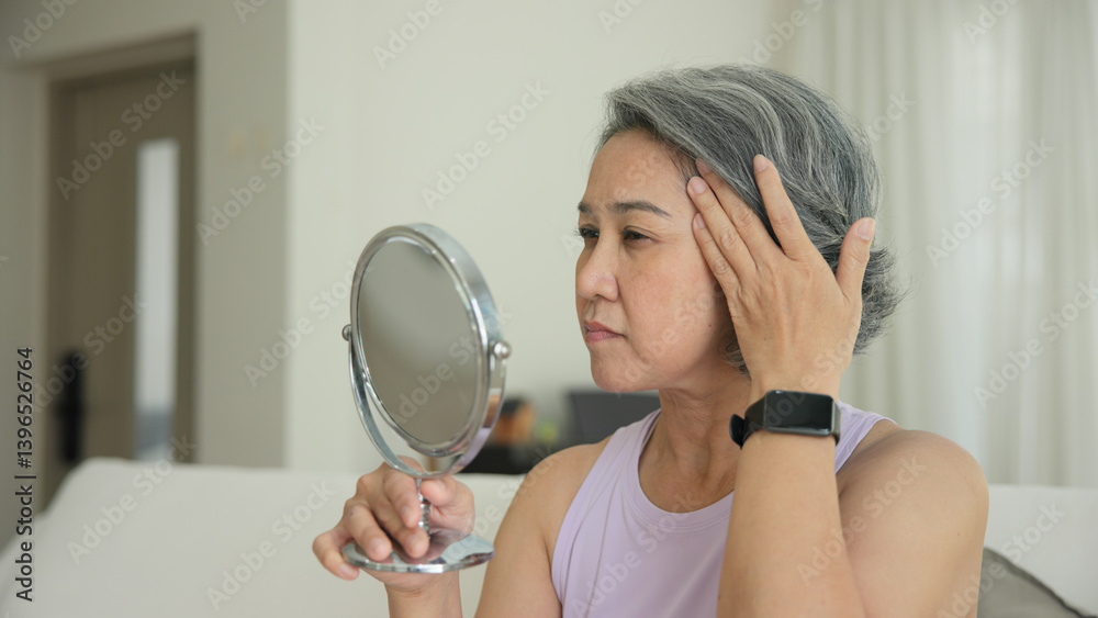 Asia adult people middle age old woman look at mirror dry skin face hand touch neck cheek stress sad at home elder health care aging beauty issue. Asian female aged eye botox filler plastic surgery. Asia adult people middle age old woman look at mirror dry skin face hand touch neck cheek stress sad at home elder health care aging beauty issue. Asian female aged eye botox filler plastic surgery.