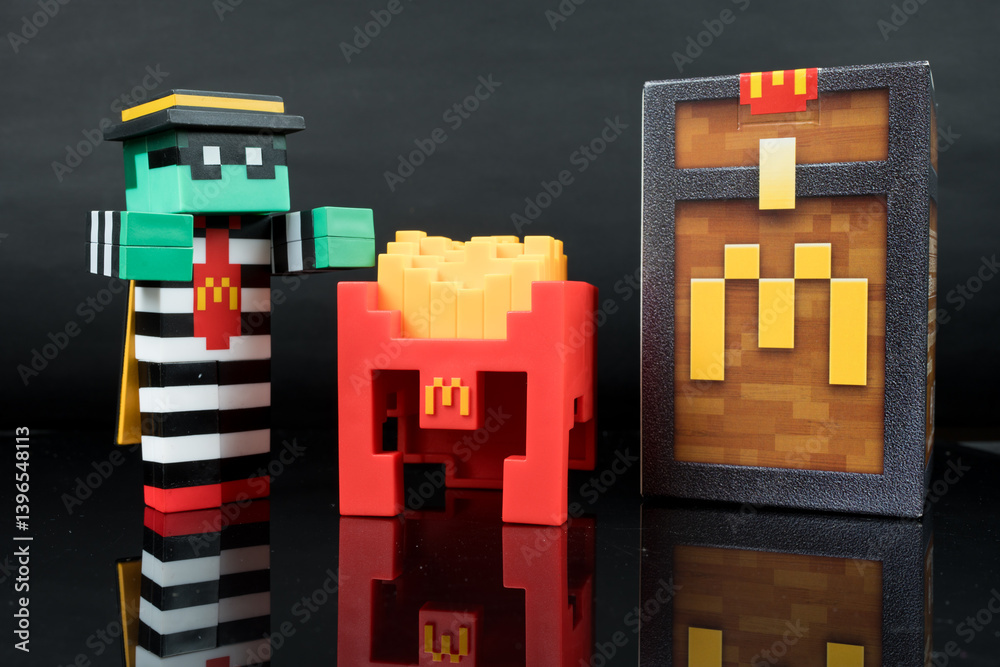 Fototapeta premium Bangkok, Thailand - April 10, 2025 : Zombie hamburglar and Minecraft fries helmet, Minecraft blind box from McDonald's collaborates.