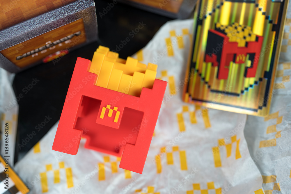 Fototapeta premium Bangkok, Thailand - April 10, 2025 : Fry Helmet Minecraft from McDonald, Toy form Minecraft blind box from McDonald's collaborates Minecraft the movice