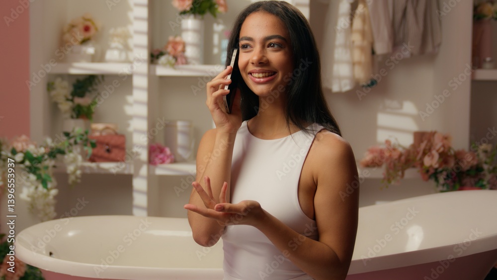 Latina hispanic ethnic beautiful woman smiling girl talking smartphone cheerful happy funny female speak tell gossip mobile phone call connection friendly conversation in home bathroom beauty routine Latina hispanic ethnic beautiful woman smiling girl talking smartphone cheerful happy funny female speak tell gossip mobile phone call connection friendly conversation in home bathroom beauty routine