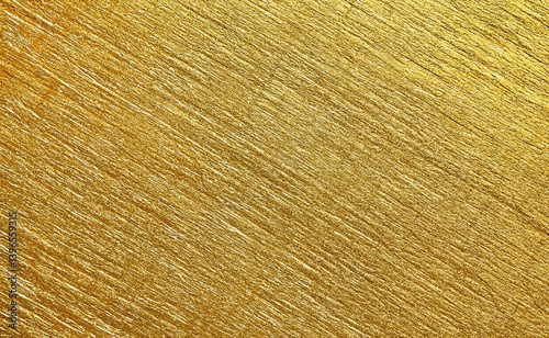A gold-colored paper with a shimmering finish, creating a rich and luxurious background. The texture displays subtle patterns, enhancing the metallic appearance and offering a reflective sheen.

