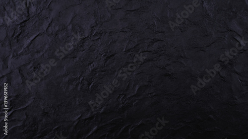 Textured black surface with deep, rich appearance, perfect for backgrounds or design elements