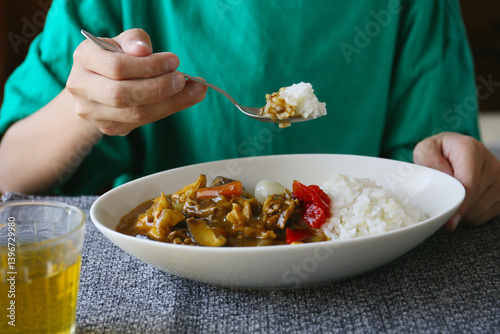 eating of japanese style curry rice, a child hand, no face