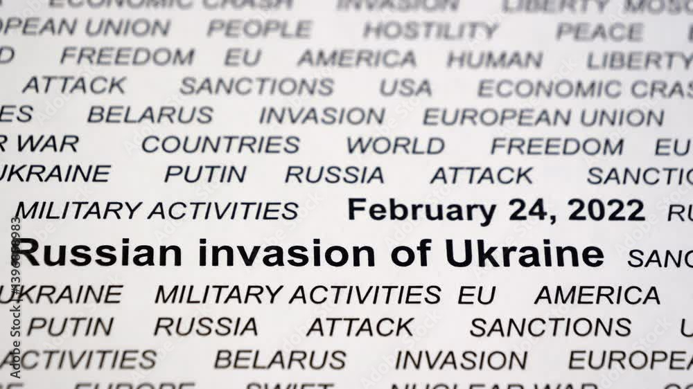 Text related to Ukraine. Crisis. Sanctions. Military activities. Russian invasion of Ukraine concept. Camera slowly moving sideways. Selective focus. Closeup. Text related to Ukraine. Crisis. Sanctions. Military activities. Russian invasion of Ukraine concept. Camera slowly moving sideways. Selective focus. Closeup.