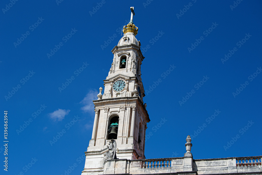 Historic Bell Tower Basilica of Our Lady of the Rosary of Fatima, Portugal Against a Clear Blue Sky Historic Bell Tower Basilica of Our Lady of the Rosary of Fatima, Portugal Against a Clear Blue Sky