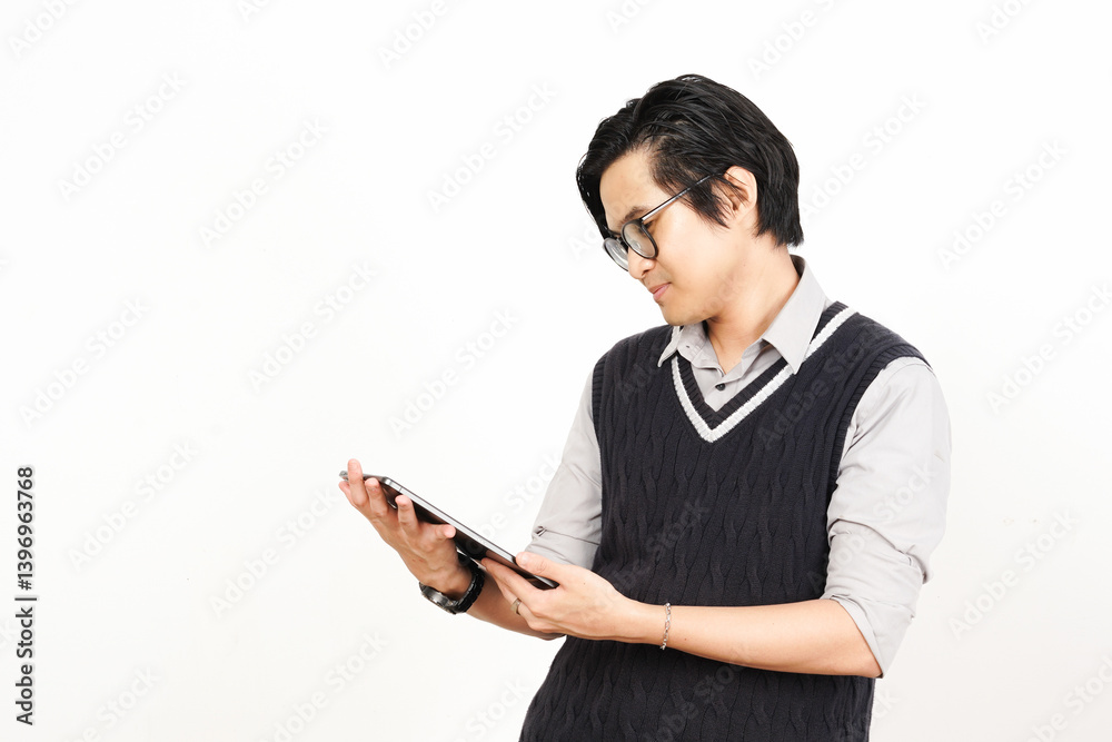 Holding and Using Tablet Of Handsome Asian Man Wearing Black Suit Isolated On White Background Holding and Using Tablet Of Handsome Asian Man Wearing Black Suit Isolated On White Background
