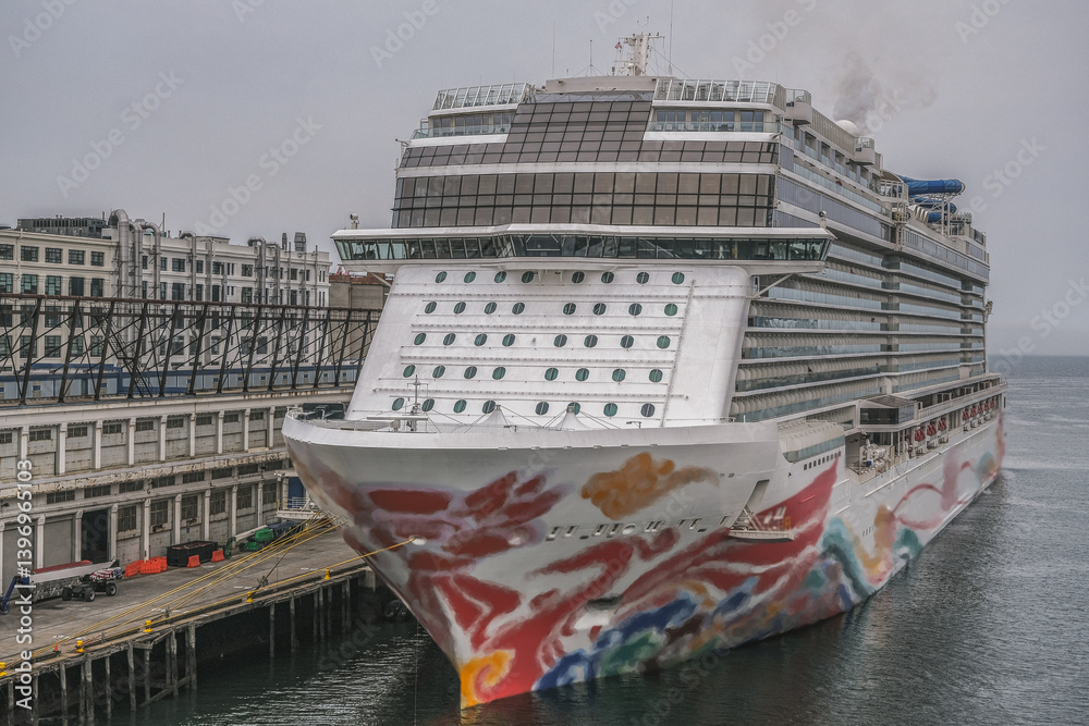 Mega modern family cruiseship cruise ship liner Joy docked at Boston terminal for Caribbean or Bermuda cruise on rainy grey cloudy day