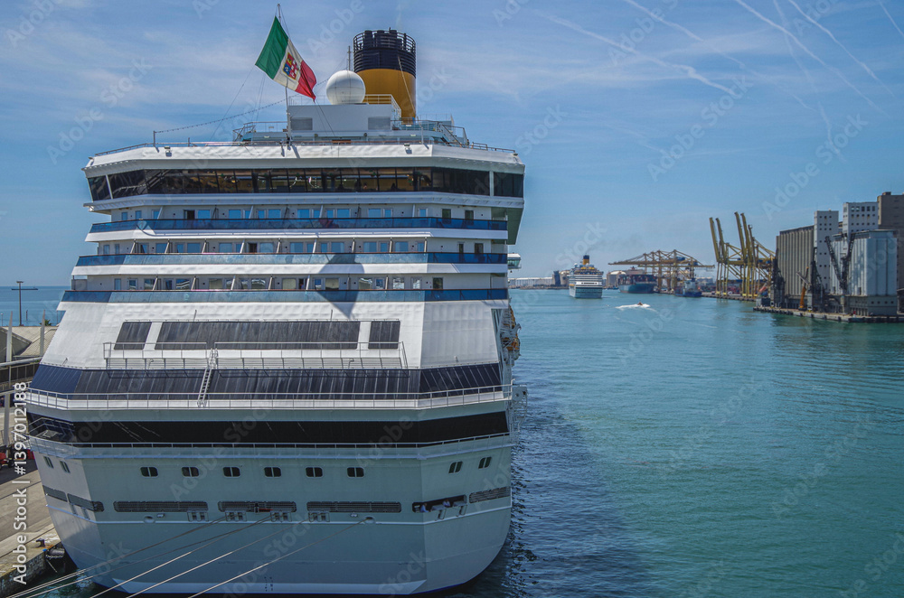 Modern family cruiseship Pacifica and other cruise ship liners in port of Barcelona, Spain on sunny summer day seen from landside during Mediterranean cruising