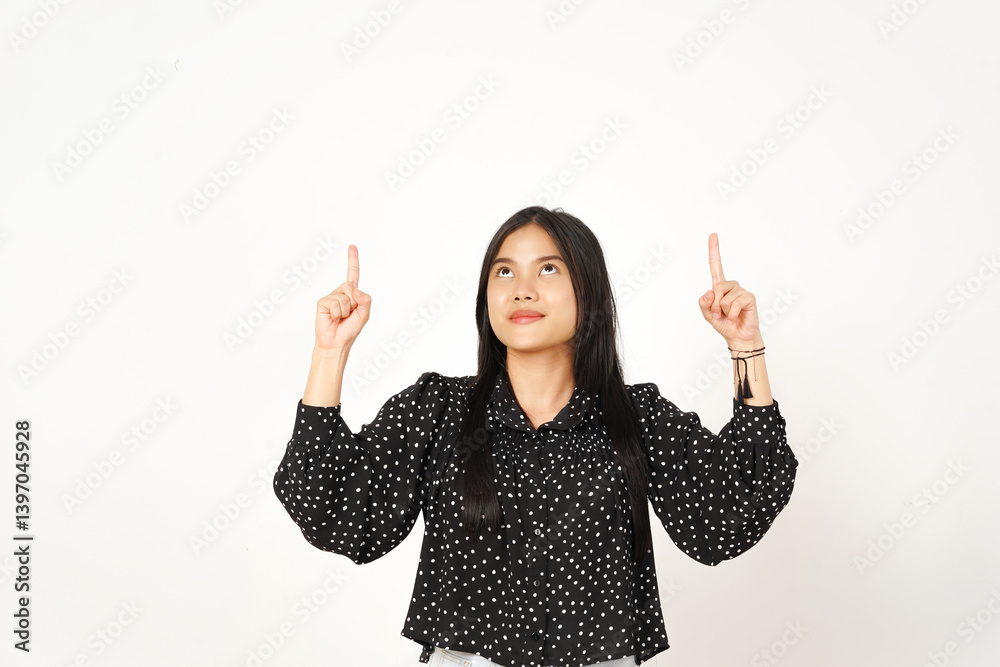 Smiling Presenting and Pointing up at Copy space wall Of Beautiful Asian Woman wearing black Isolated On White Background Smiling Presenting and Pointing up at Copy space wall Of Beautiful Asian Woman wearing black Isolated On White Background