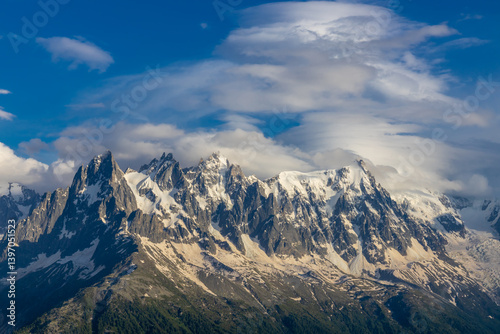 Chamonix Montblanc beautiful alpine mountain summits landscape. Alps mountains with snow and glacier above green valley of Chamonix in France. Alps beautiful scenery in summer