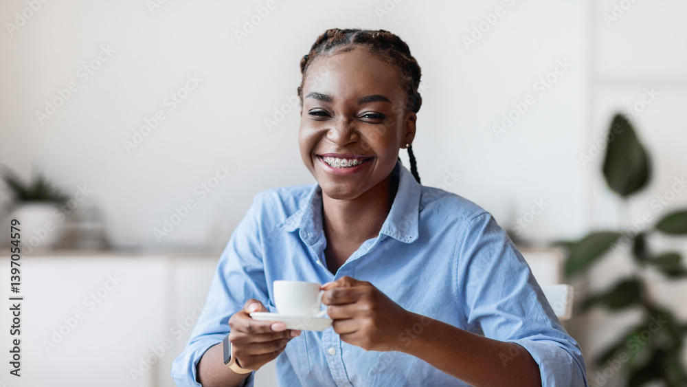 Cheerful African American Woman Enjoying Coffee At Workplace In White Office, Having Break At Work, Smiling Black Secretary Sitting At Desk With Cup Of Hot Drink, Looking At Camera, Free Space Cheerful African American Woman Enjoying Coffee At Workplace In White Office, Having Break At Work, Smiling Black Secretary Sitting At Desk With Cup Of Hot Drink, Looking At Camera, Free Space