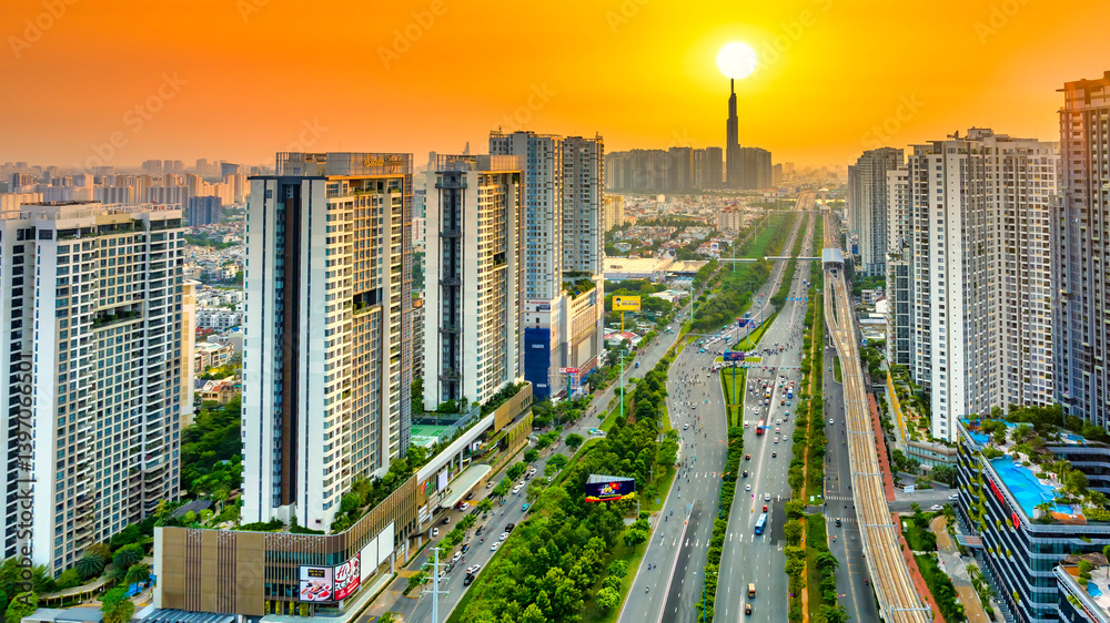 Aerial view of Saigon cityscape with a complex highway intersection. Urban development texture, transport infrastructure, Financial and business centers